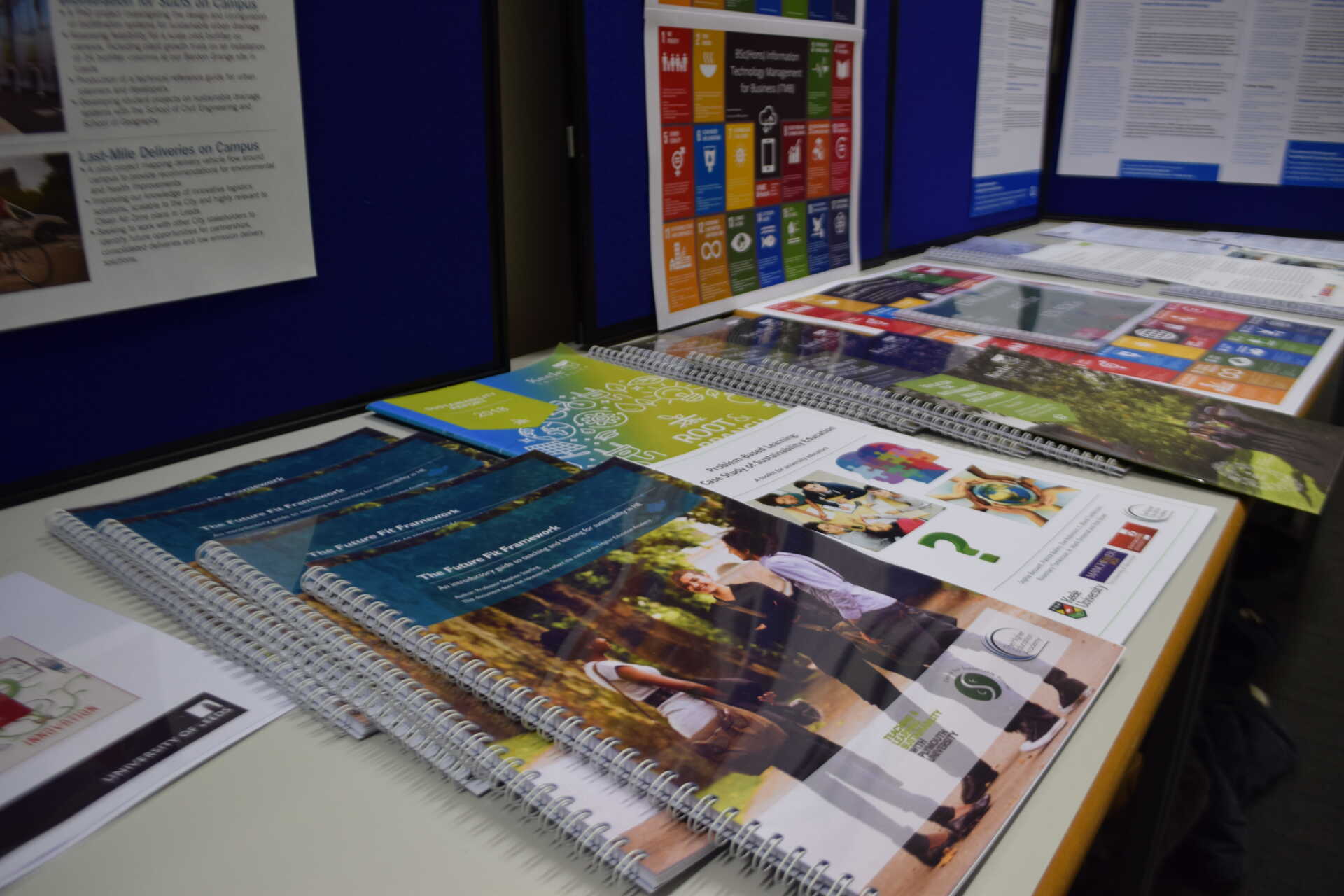 A table filled with brochures and leaflets about education for sustainable development