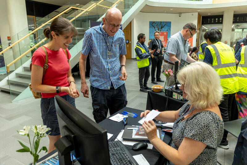 Two people being registered for an event