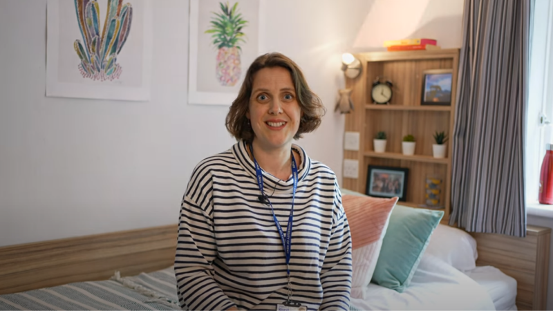 Head of Accommodation sitting in a Park Wood House Bedroom